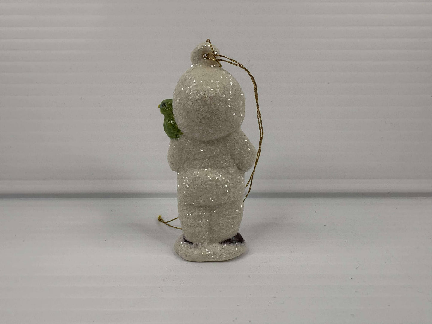 Handmade Porcelain Ornament – Caroling Child with Bird