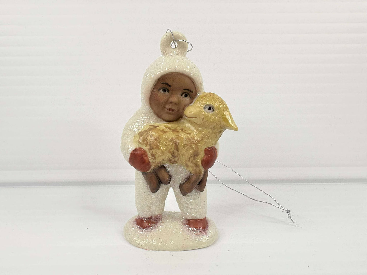 Snow Baby holding Lamb