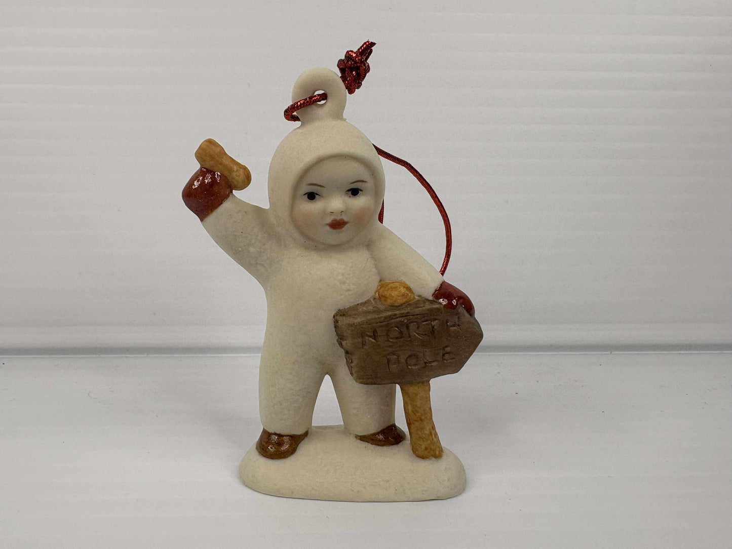 Snow Baby with North Pole sign